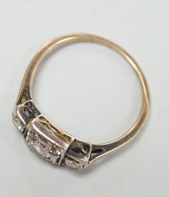 An early 20th century yellow metal and diamond cluster set ring, size K, gross weight 2 grams.